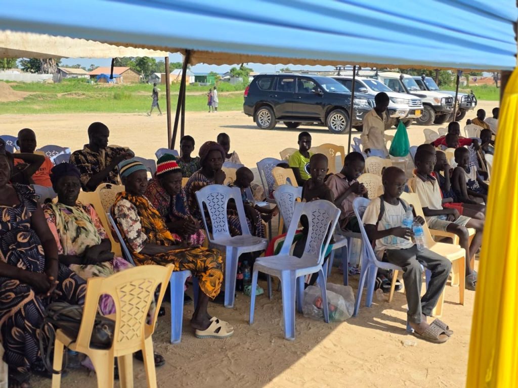 Residents follow the proceedings at Bor Freedom Square