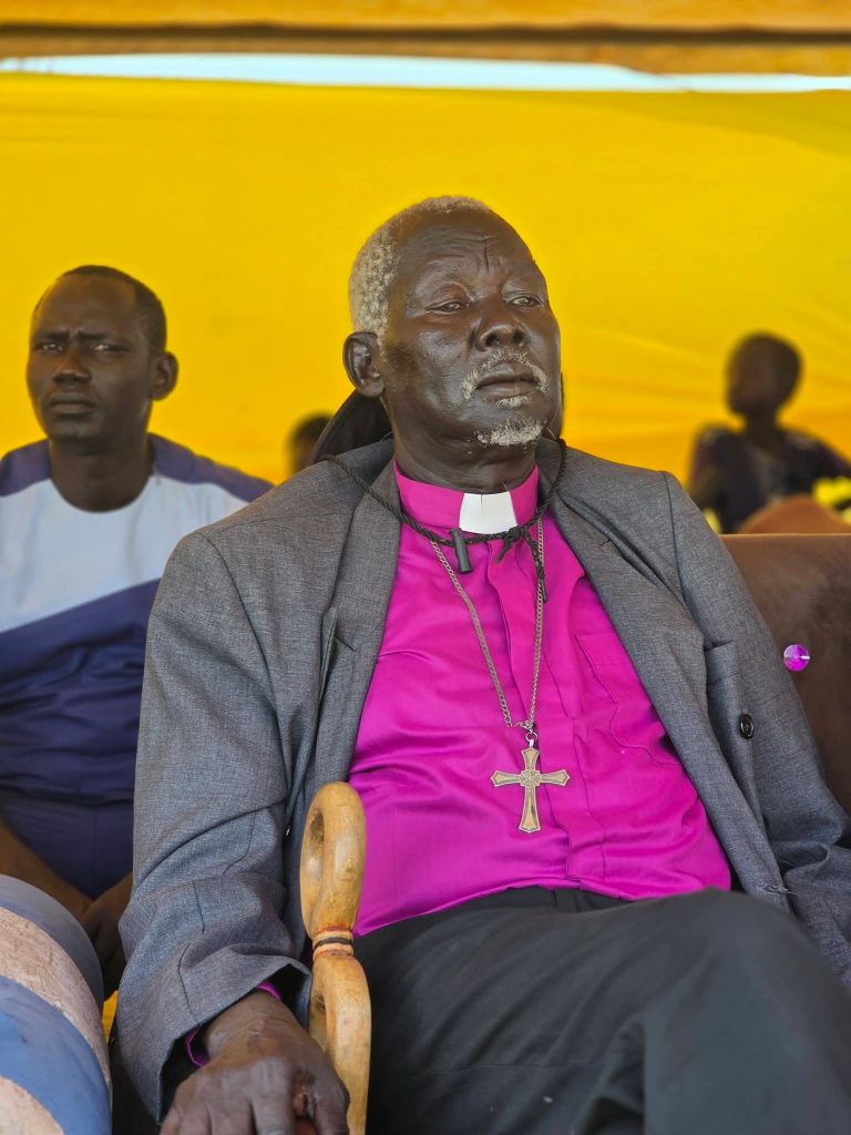 A church leader follows the proceedings