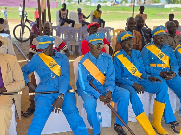 Uniformed personnel seated at the launch