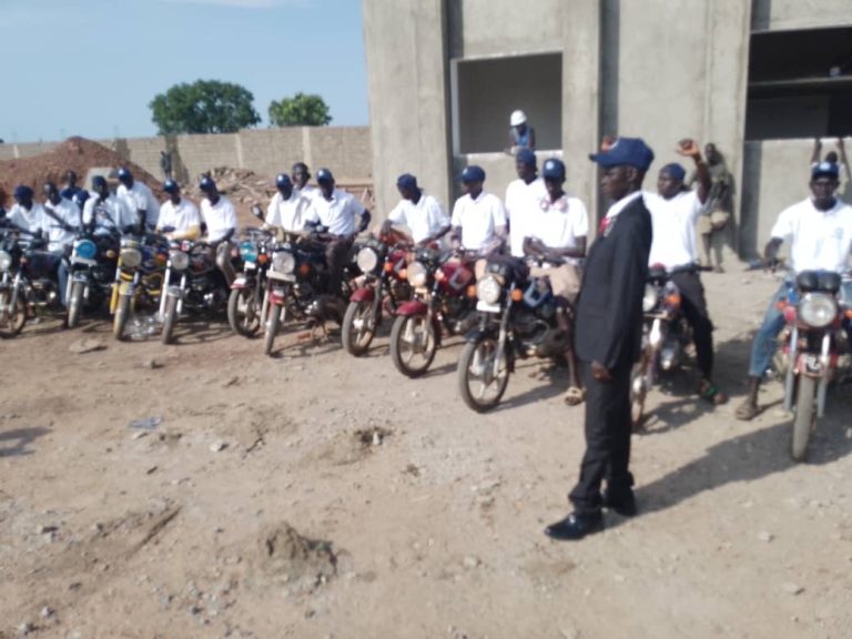 An official speaks to riders before the ride