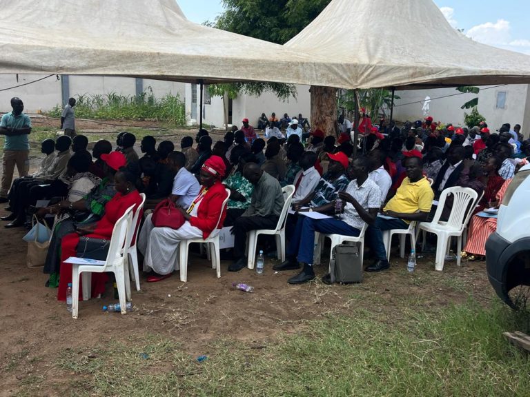 Residents attend the opening of the committee office
