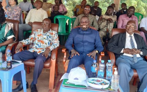 Officials and guests follow the proceedings