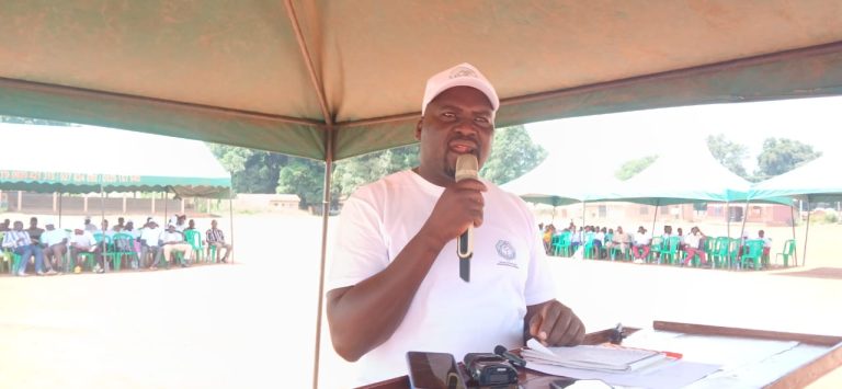 Addressing the gathering from the lectern
