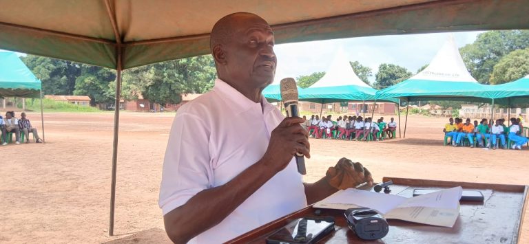 Addressing participants at the ceremony