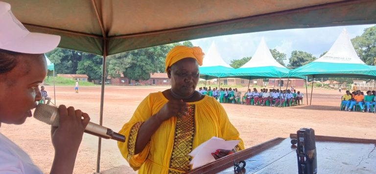 A speaker addresses the ceremony