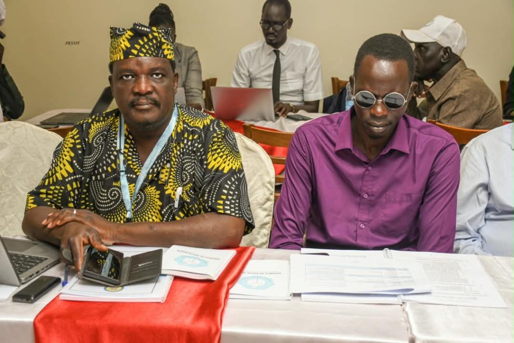Participants follow the proceedings at the training in Juba