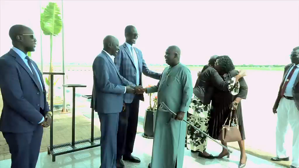 Hon. Gabriel Bol Deng is greeted by officials who came to receive him at Juba International Airport